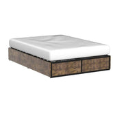 A 
 made bed with a mattress resting on a box spring, emphasizing comfort and support in a bedroom setting.
